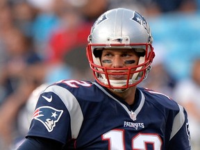 Tom Brady #12 of the New England Patriots looks to the sideline in the 1st quarter against the Carolina Panthers during their preseason NFL game at Bank of America Stadium on August 28, 2015 in Charlotte, North Carolina. (Grant Halverson/Getty Images/AFP)