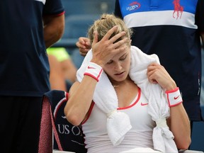 Eugenie Bouchard, of Canada, takes a break between games against Dominika Cibulkova, of Slovakia, during the third round of the U.S. Open tennis tournament, Friday, Sept. 4, 2015, in New York. Bouchard has withdrawn from the U.S. Open with a concussion. THE CANADIAN PRESS/AP/Charles Krupa