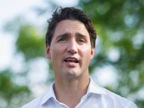 Liberal Leader Justin Trudeau speaks to the media during a federal election campaign stop in Laval, Que., Sunday, September 6, 2015. THE CANADIAN PRESS/Graham Hughes