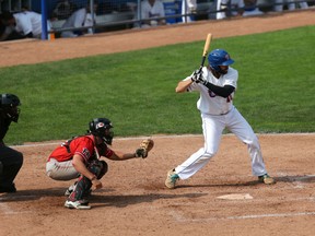 Ottawa Champions' Nick Giarraputo takes a swing against the Trois-Rivieres Aigles at RCGT Park on Sunday, Sept. 6, 2015. (Chris Hofley/Ottawa Sun)