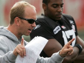 CALGARY - Quarterbacks coach Dave Dickenson talks beside QB Daryll Clark a Calgary Stampeders practice at McMahon Stadium on Friday September 3, 2010. The Stamps are gearing up for their Labour Day Classic at home against the Edmonton Eskimos. LYLE ASPINALL/CALGARY SUN/QMI AGENCY