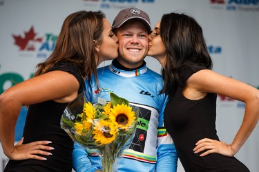 Stage winner Lasse-Norman Hansen with Cannondale-Garmin gets a kiss while celebrating his win during the stage presentation at the end of Stage 5 of the Tour of Alberta, which ran from Edson to Spruce Grove, in Spruce Grove, Alta., on Sunday September 6, 2015. The race finishes in Edmonton on Sept. 7. Ian Kucerak/Edmonton Sun/Postmedia Network