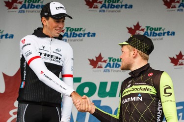 Stage winner Lasse-Norman Hansen (right) with Cannondale-Garmin shakes hands with second place finisher Laurent Didier of Trek Factory Racing during the stage presentation at the end of Stage 5 of the Tour of Alberta, which ran from Edson to Spruce Grove, in Spruce Grove, Alta., on Sunday September 6, 2015. The race finishes in Edmonton on Sept. 7. Ian Kucerak/Edmonton Sun/Postmedia Network