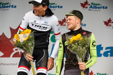 Stage winner Lasse-Norman Hansen (right) with Cannondale-Garmin chats with second place finisher Laurent Didier of Trek Factory Racing during the stage presentation at the end of Stage 5 of the Tour of Alberta, which ran from Edson to Spruce Grove, in Spruce Grove, Alta., on Sunday September 6, 2015. The race finishes in Edmonton on Sept. 7. Ian Kucerak/Edmonton Sun/Postmedia Network