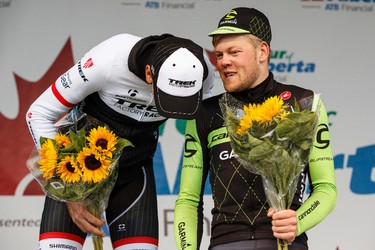 Stage winner Lasse-Norman Hansen (right) with Cannondale-Garmin chats with second place finisher Laurent Didier of Trek Factory Racing during the stage presentation at the end of Stage 5 of the Tour of Alberta, which ran from Edson to Spruce Grove, in Spruce Grove, Alta., on Sunday September 6, 2015. The race finishes in Edmonton on Sept. 7. Ian Kucerak/Edmonton Sun/Postmedia Network