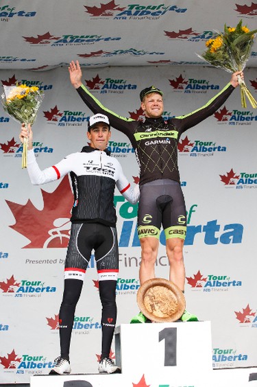 Stage winner Lasse-Norman Hansen (right) with Cannondale-Garmin and second place finisher Laurent Didier Trek Factory Racing celebrate during the stage presentation at the end of Stage 5 of the Tour of Alberta, which ran from Edson to Spruce Grove, in Spruce Grove, Alta., on Sunday September 6, 2015. The race finishes in Edmonton on Sept. 7. Ian Kucerak/Edmonton Sun/Postmedia Network