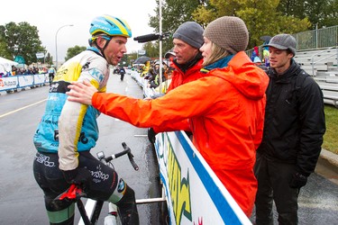 Kris Dahl (left) of Team Smartstop is greeted by supportrers at the finish line of Stage 5 of the Tour of Alberta, which ran from Edson to Spruce Grove, in Spruce Grove, Alta., on Sunday September 6, 2015. The race finishes in Edmonton on Sept. 7. Ian Kucerak/Edmonton Sun/Postmedia Network