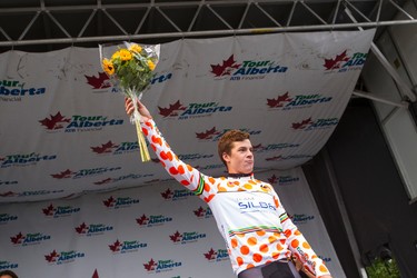 Mountain jersey winner Benjamin Perry with Silber Pro Cycling celebrates during the stage presentation at the end of Stage 5 of the Tour of Alberta, which ran from Edson to Spruce Grove, in Spruce Grove, Alta., on Sunday September 6, 2015. The race finishes in Edmonton on Sept. 7. Ian Kucerak/Edmonton Sun/Postmedia Network
