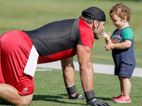 LYLE ASPINALL/CALGARY SUN
Randy Chevrier plays with his one-year-old son Kyle after a Calgary Stampeders football practice at McMahon Stadium in Calgary on Saturday, September 1, 2012. They were preparing for the annual Labour Day Classic against the Edmonton Eskimoes on Monday, Sept. 3.