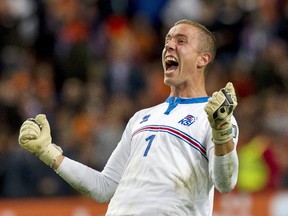 Goalkeeper Hannes Halldorsson celebrates Iceland's 1-0 victory over the Netherlands after their Euro 2016 qualifying match in Amsterdam on Sept. 3, 2015. (Michael Kooren/Reuters)