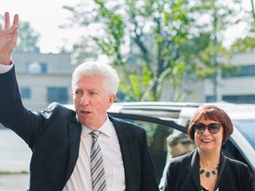 Bloc Quebecois Leader Gilles Duceppe waves to supporters as he and his wife Yolande Brunelle arrive for a general council meeting during a federal election campaign stop in Montreal, Monday, September 7, 2015. THE CANADIAN PRESS/Graham Hughes