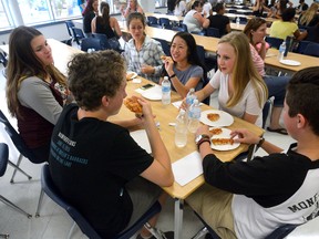 Grade nine students Cathryn Wize, Ewan Mason, Cole Scott, Sarah Norman, Jessica Nguyen, and Sydney Lam, l-r, lunch on pizza during orientation at Beal Secondary School, on Thursday Sept 3, 2015.
(MORRIS LAMONT, The London Free Press)