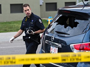 A vehicle with damaged windows, at the scene of a shooting in Edmonton on Monday. (CODIE MCLACHLAN/Edmonton Sun)