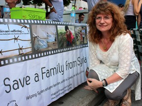 Annette Wilde, project leader at Save a Family from Syria, at the Kingston Multicultural Arts Festival in Kingston on Sunday. Steph Crosier/Kingston Whig-Standard/Postmedia Network