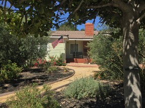 A home is shown, Monday, Sept. 7, 2015, in the Los Angeles suburb of La Canada-Flintridge, Calif., where on Sunday night, firefighter James M. Taylor fatally shot his wife, Cecilia Hoschet, herself a deputy with the Los Angeles County Sheriff's Department, before later killing himself at a county fire station. (AP Photo/Damian Dovarganes)