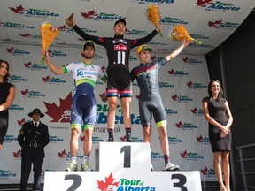 (Left to right) Second place winner Michael Matthews with Orica-Greenedge, first place winner Nikias Arndt with Giant-Alpecin and third place winner Dion Smith with Hincapie Racing Team are seen during the winners medal ceremony at the Tour of Alberta final in Edmonton, Alta., on Monday September 7, 2015. Ian Kucerak/Edmonton Sun/Postmedia Network