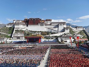 In this photo released by China's Xinhua News Agency, a grand ceremony marking the 50th anniversary of the founding of the Tibet Autonomous Region is held at the square of the Potala Palace in Lhasa, capital of southwest China's Tibet Autonomous Region, Tuesday, Sept. 8, 2015. (Chen Yehua/Xinhua via AP)