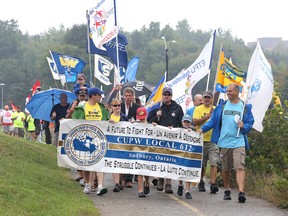 The Sudbury & District Labour Council's Labour Day parade makes its way through Bell Park in Sudbury, Ont. on Monday September 7, 2015. Gino Donato/Sudbury Star/Postmedia Network