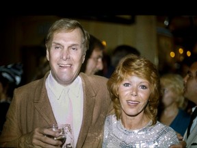In this Tuesday, Sept. 13, 1983 file photo, actors Judy Carne and Alan Sues, left, of "Rowan And Martin's Laugh-In" are shown during a "Laugh-In" reunion party, in Los Angeles. (AP Photo/Doug Pizac, file)
