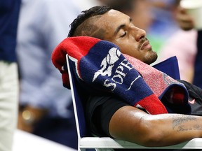 Nick Kyrgios of Australia sleeps during a changeover against Andy Murray of Great Britain (not pictured) on day two of the 2015 U.S. Open tennis tournament at USTA Billie Jean King National Tennis Center. Murray won 7-5, 6-3, 4-6, 6-1. Geoff Burke-USA TODAY Sports