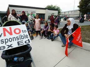 Members of the Thorncliffe community march through the streets on Tuesday September 8, 2015 before arriving at Thorncliffe Park Public School to protest the Ontario Liberal government's institution of Sex-Ed curriculum. (Jack Boland/Toronto Sun)
