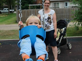 One-and-a-half year old Levi Bryans gets a push from mom Rachel as he rides the swing during Alvinston's inaugural Arts and Music Festival held on Aug. 29. 
CARL HNATYSHYN/SARNIA THIS WEEK