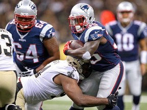 New England Patriots running back Jonas Gray (35) is tackled by New Orleans Saints defensive end Cameron Jordan (94) in the second quarter at Mercedes-Benz Superdome. Chuck Cook-USA TODAY Sports