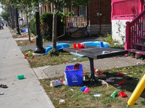 Houses along University Avenue on Monday, between Johnson and Earl streets, were a little worse for wear after an unsanctioned street party the night before. (Julia McKay/The Whig-Standard)