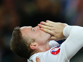 Wayne Rooney celebrates with Harry Kane after scoring the second goal for England from the penalty spot and becoming England's all time leading goalscorer. (REUTERS/Eddie Keogh)