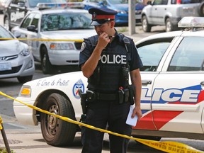 Toronto Police on the scene of a stabbing involving a student outside of Central Tech school. (MICHAEL PEAKE, Toronto Sun)