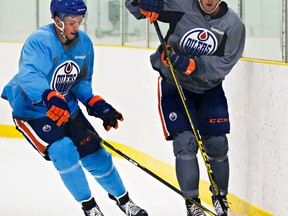 Connor McDavid evades Martin Gernat during an Oilers skate at the Royal Glenora arena Wednesday. McDavid will be staying with Luke Gazdic and Taylor Hall. (Codie McLachlan, Edmonton Sun)