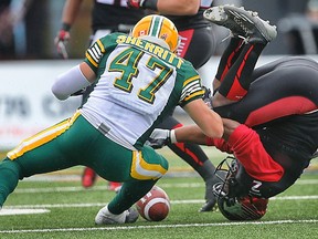 Stampeders running back Tim brown was upended after being hit by Jordan Lynch, who is not in this photo, during a kick return in the second quarter. (Al Charest, Postmedia Network)