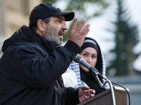 Palestinian refugee Ahmad Maouad, who escaped Syria, speaks during a Refugees Welcome rally held at the Alberta Legislature in Edmonton, Alta., on Tuesday September 8, 2015. Hundreds of people joined a rally and candlelight vigil for Syrian refugees while calling for Canada to open its doors to people fleeing the civil war in Syria. Ian Kucerak/Edmonton Sun/Postmedia Network