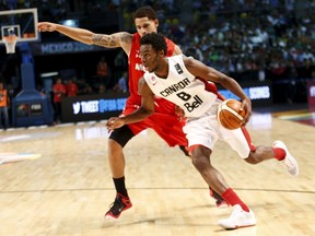 Canada's Andrew Wiggins dribbles the ball past Mexico's Juan Toscano during their 2015 FIBA Americas Championship basketball game, at the Sports Palace in Mexico City September 8, 2015. (REUTERS/Henry Romero)