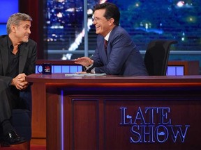 George Clooney (L) and Stephen Colbert during the first ever episode of The Late Show with Stephen Colbert. 

(Courtesy CBS)