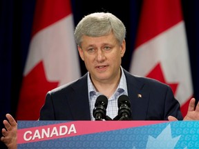 Conservative leader Stephen Harper takes questions from the media following a question and answer session with the Ontario Chamber of Commerce during a campaign stop in Welland, Ont., on Sept. 9, 2015. (THE CANADIAN PRESS/Adrian Wyld)