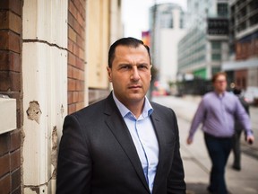 Syrian refugee to Canada Hussein Adb Al Rahim stands for a photo in downtown Toronto on Wednesday, September 9 2015. Hussein came to Canada in 2012 and has been waiting for a hearing for his refugee claim ever since.THE CANADIAN PRESS/Aaron Vincent Elkaim