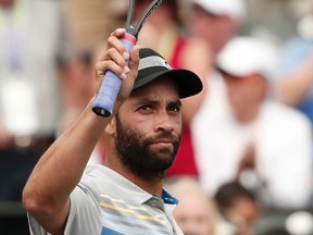 James Blake of the U.S. waves to the crowd after his victory over Julien Benneteau of France at the Sony Open tennis tournament in Key Biscayne, Fla., in this March 22, 2013 file photograph. (REUTERS/Kevin Lamarque/Files)