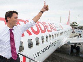 Liberal leader Justin Trudeau gives the thumbs up as he boards his campaign plane in Toronto, Wednesday, Sept, 9, 2015.  THE CANADIAN PRESS/Jonathan Hayward