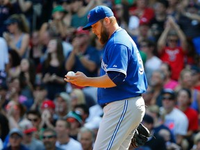 Toronto Blue Jays starting pitcher Mark Buehrle heads back to the mound after giving up a run to the Boston Red Sox at Fenway Park in Boston on Sept. 7, 2015. (AP Photo/Winslow Townson)