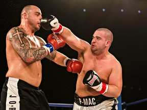 Paul MacKenzie, right, shown here in his victory over Jared Kilkenny in March, characterizes his fight Friday as a classic east-west bout. (Codie McLachlan, Edmonton Sun)