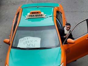 A taxi driver protests Uber in Toronto on June 1, 2015. THE CANADIAN PRESS/Nathan Denette
