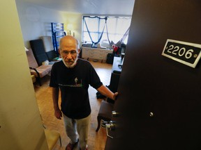 TCHC tenant Galal Donia, who owes $65,000 in rent arrears, shows the Toronto Sun his 200 Wellesley St. E. apartment. (Stan Behal/Toronto Sun)