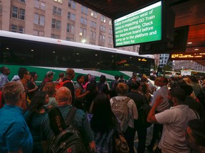 GO Transit users swarm a Union Station bus Wednesday September 9, 2015. trying to get to their destinations after the train route was shutdown down because of a suspicious package left at the Exhibition Place station. (Jack Boland/Toronto Sun)
