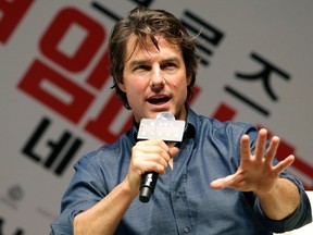 Tom Cruise speaks to his fans during the guest visit event for fans to promote his latest movie "Mission: Impossible - Rogue Nation" at a movie theatre in Seoul, South Korea, Friday, July 31, 2015. (AP Photo/Lee Jin-man)