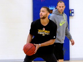 Garrett Williamson works out under the watchful eye of London Lightning coach Kyle Julius at the London Central Y on Wednesday. Williamson  returned to London in part because Julius has said he will help the promising player improve his game. (MORRIS LAMONT, The London Free Press)