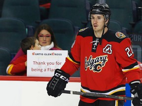 A young hockey fan with a sign thanking Calgary Flames forward Curtis Glencross during warmup at a game in Calgary on February 20, 2015. (Al Charest/Calgary Sun)