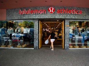 A woman walks into a store of yogawear retailer Lululemon Athletica in downtown Vancouver in this June 11, 2014 file photo. Lululemon reported higher-than-expected profit and revenue on September 10, 2015. REUTERS/Ben Nelms/Files