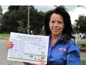 Mary Anne Udvari, chair of the Kent Federation of Agriculture's Round the County Agri-Tour, holds a copy of this year's tour map near downtown Chatham. City and country folk are invited to take part in the free, self-guided tour that showcases local agriculture on  Sunday (Sept.13)