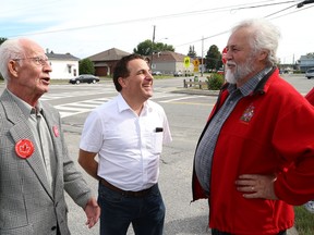 Marc Serre, middle, talks to former Nickel Belt Liberal MP Ray Bonin, right, as Serre's dad, Gaetan, who was also a former Nickel Belt Liberal MP, looks on at the opening of Marc Serre's campaign headquarters in Hanmer, Ont. on Wednesday September 9, 2015. Gaeten Serre died Tuesday. John Lappa/Sudbury Star/Postmedia Network